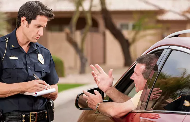 Police officer speaking with a driver during a traffic stop